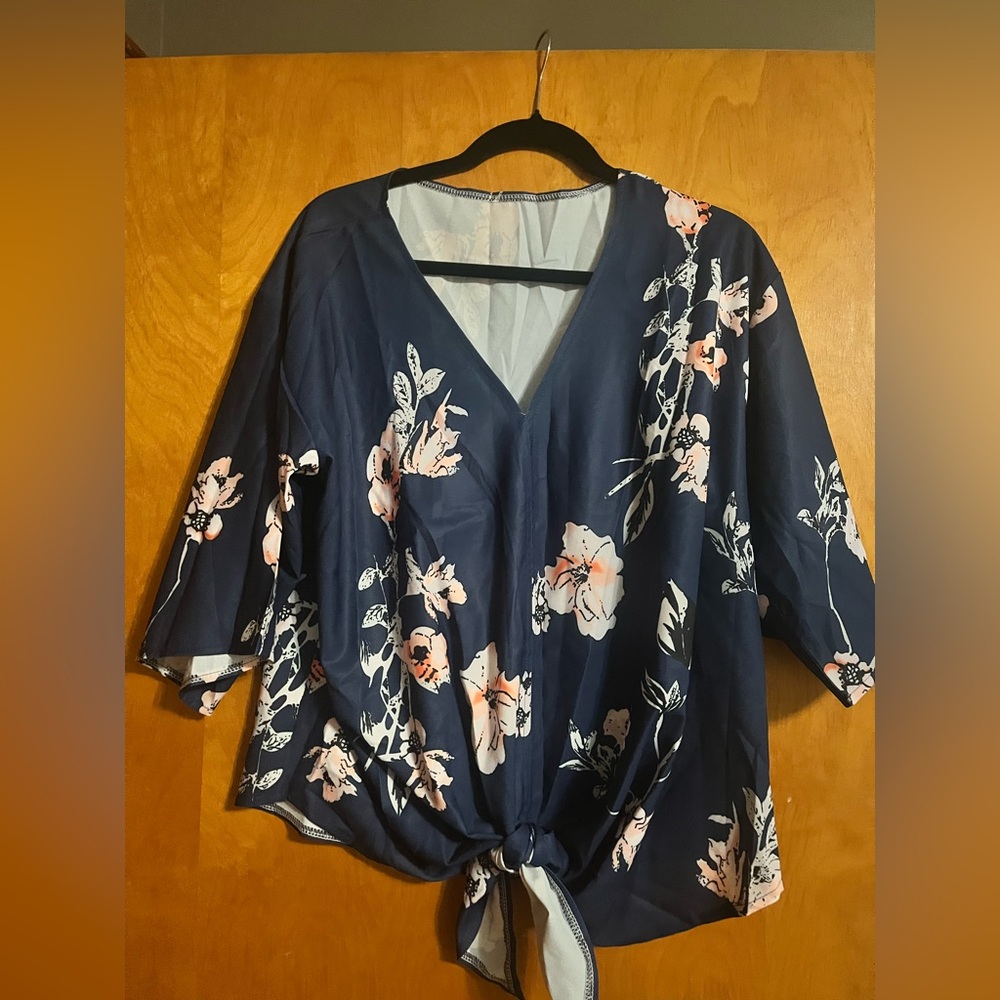 Floral, flower blouse that ties in front.